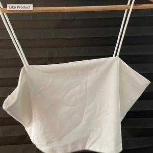 A white crop top, very short